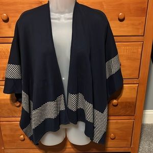 Cabi reversible cape poncho. Buttons under arms to keep it in place.